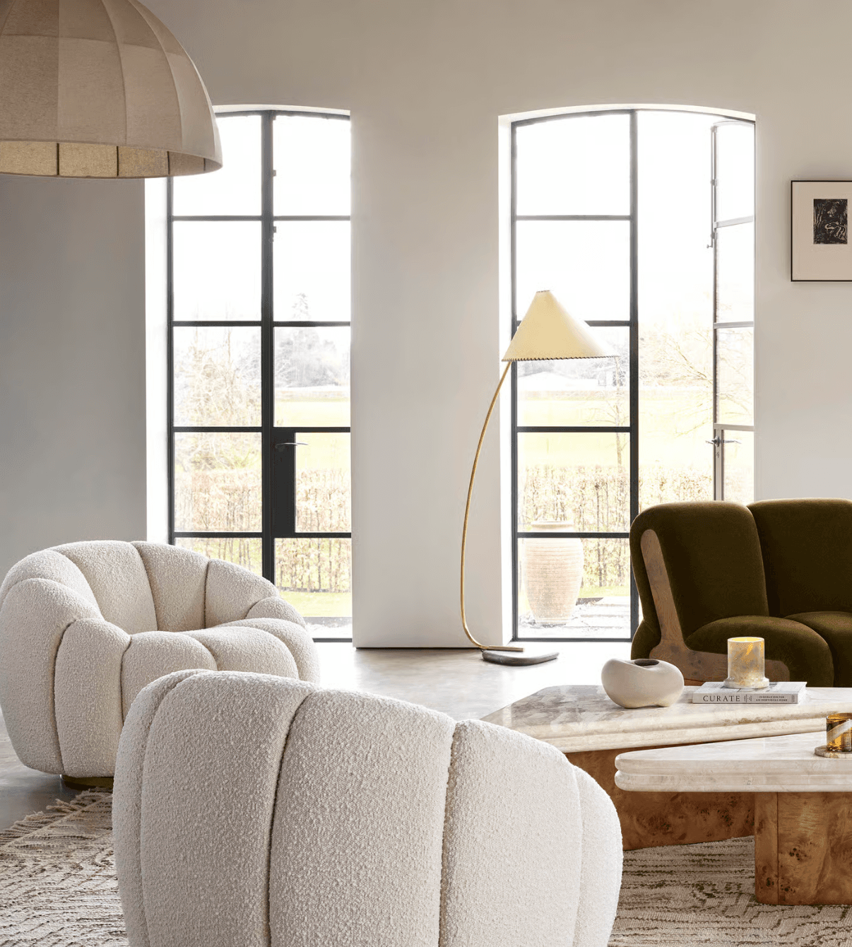 Modern interior design room scene with lounge chair and brass floor lamp showcasing procurement workflow